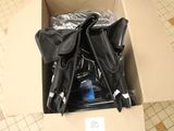 two umbrellas in a cardboard box on the floor