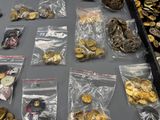 a lot of gold and silver coins on a table