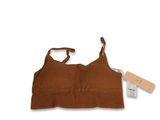 a close up of a brown bra top with a tag on it
