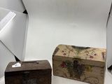 a small wooden box sitting on a table next to a white backdrop