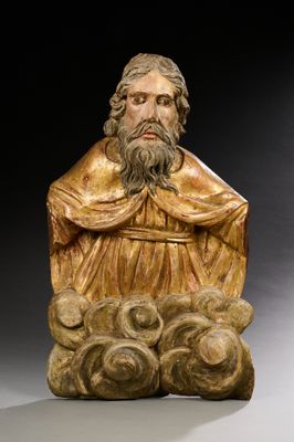 une image représentant la statue d'un homme barbu assis sur un rocher