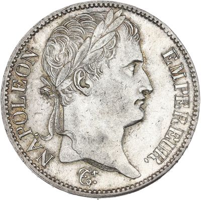 gros plan d'une pièce de monnaie sur laquelle figure une tête de femme