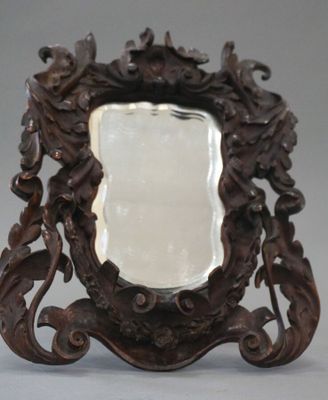 a mirror that is sitting on top of a table