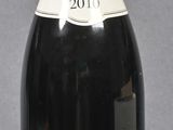 a bottle of wine that is sitting on a table