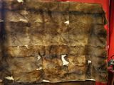 a large piece of fur sitting on top of a wooden table
