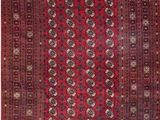 a red and black rug with a pattern on it