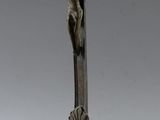 an old bronze crucifix with a cross on top of it
