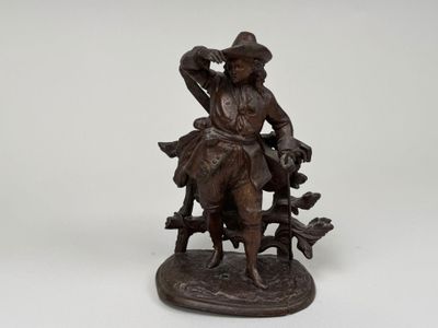 figurine en bronze représentant un homme avec un chien et un chat