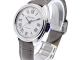 a close up of a wrist watch with roman numerals