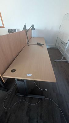 an image of a desk with two computers on it