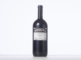 a bottle of wine that is sitting on a table