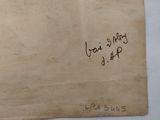 an old piece of paper with writing on it sitting on a table