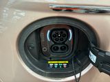 a close up of a car ' s plugged in to a charger