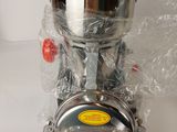 a silver bowl sitting on top of a silver machine