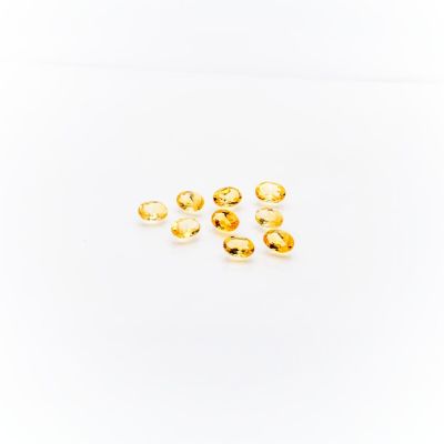 a group of fish oil capsules on a white surface