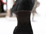 a statue of a man in a military uniform on a table