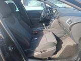 the interior of a car with the door open and the seats down