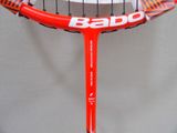 a close up of a tennis racket with a logo on it