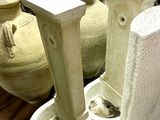 many vases and urns that are on the table