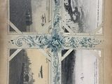 a cross made out of old photos on a piece of paper