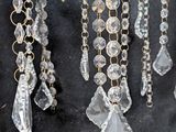 a chandelier that has a bunch of crystal beads hanging from it