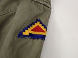 a close up of a patch on the back of a pair of pants