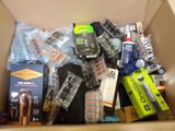 a cardboard box filled with many different types of items