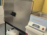 a machine that is sitting in a kitchen next to a sink