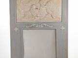 a mirror with a picture of a man and a woman on it