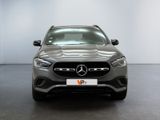the front of a grey mercedes s - class parked in a showroom