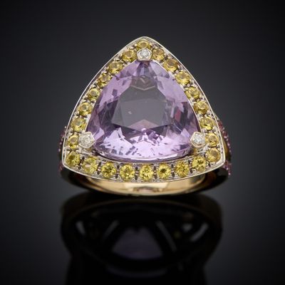 an amethorate and yellow sapphire ring set in 18k yellow gold