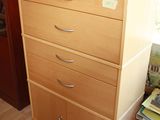 an image of a dresser in a bedroom with wood floors