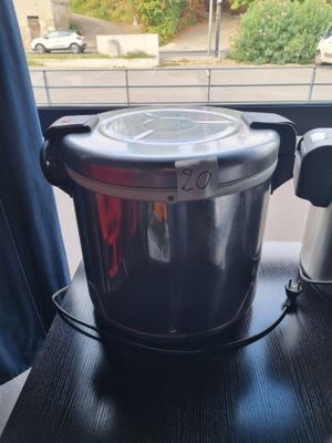 a pot that is sitting on a table next to a window