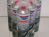 four cans of power cleaner sitting on top of a white counter