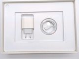 a white box with a charger and a cable attached to it