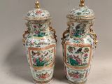 pair of chinese vases with birds and flowers painted on them