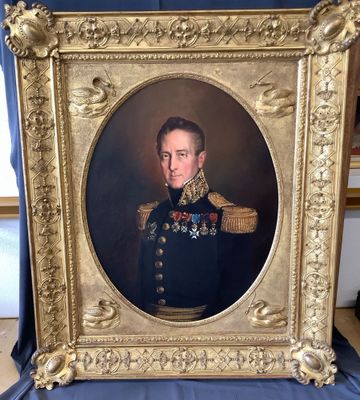 portrait of a man in a military uniform in a gold frame