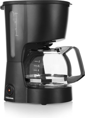 une cafetière noire posée sur un plan de travail blanc