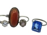 three rings with different colored stones and stones on them