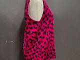 a pink and black leopard print tank top on a mannequin mannequin