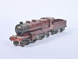 a toy train that is sitting on a white surface
