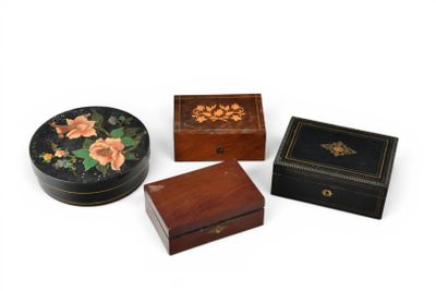 three small wooden boxes sitting next to each other on a white surface