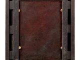 an old wooden picture frame hanging on a white wall