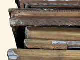 several pieces of wood are stacked on top of each other