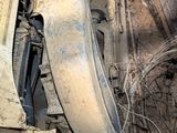 an old machine that is sitting in the dirt