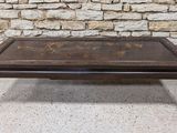 an old coffee table with a wooden top and metal legs