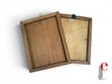 a small wooden box with a piece of paper in it