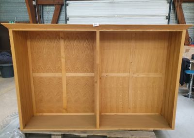 a wooden cabinet that is sitting on a pallet