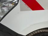 a white van with a red stripe on the side of it