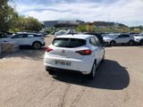 a white car that is parked in a parking lot